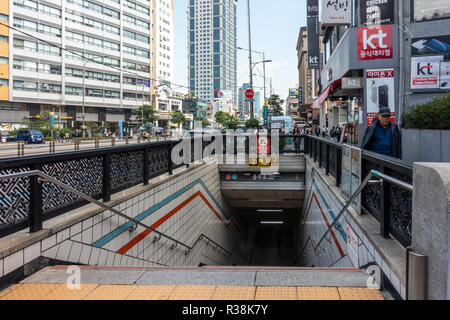 Steps lead down wards at an entrance into Chumgmuro metro station in Seoul, South Korea. Stock Photo