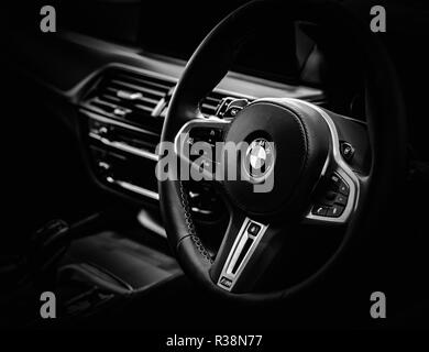 Black and white image of a modern BMW M5 F90 steering wheel. Stock Photo