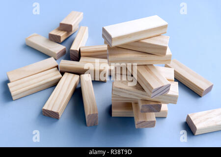 Business concept, building a business. Stacked and Collapsed on Wood Blocks. Stock Photo