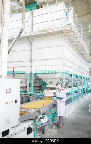 Senior Worker at Plant Stock Photo