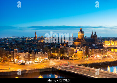 Amsterdam skyline in historical area at night, Netherlands. Ariel view of Amsterdam, Netherlands. Stock Photo