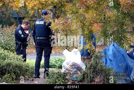 Butte, USA. 21st Nov, 2018. Policemen petrol among tents at a parking lot in Chico of Butte County, California, the United States, Nov. 21, 2018. Local officials warned that the rain after the wildfire could cause risk of flash floods and mudflows. Credit: Wu Xiaoling/Xinhua/Alamy Live News Stock Photo