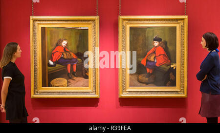 London, UK. 22nd November, 2018. Staff members view (L to R) 'My Second Sermon', 1864, and 'My First Sermon', 1863, both by Sir John Everett Millais.  Preview of 'Seen & Heard', an exhibition at the City of London Corporation’s Guildhall Art Gallery, exploring the changing role of children in Victorian Britain through 50 paintings. Credit: Stephen Chung/Alamy Live News Stock Photo