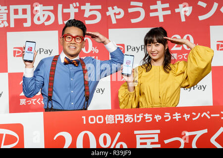 (L to R) Japanese actor Daisuke Miyagawa and singer Miki Fujimoto pose for the cameras during a news conference to announce the new smartphone payment service ''PayPay'' on November 22, 2018, Tokyo, Japan. PayPay is a smartphone payment service using barcodes (QR codes) supported by SoftBank, Yahoo Japan and Paytm, that can be used in Japanese stores including Bic Camera, Yamada Denki and Family Mart. Credit: Rodrigo Reyes Marin/AFLO/Alamy Live News Stock Photo