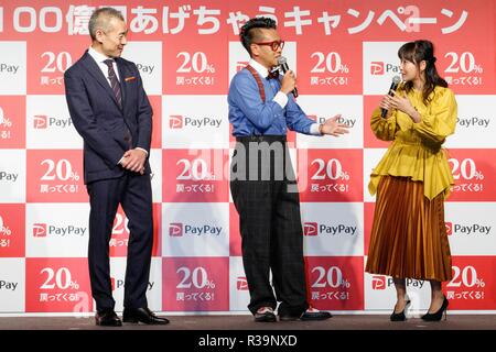 (L to R) Ichiro Nakayama, president and CEO of PayPay Corp., actor Daisuke Miyagawa and singer Miki Fujimoto, speak during a news conference to announce the new smartphone payment service ''PayPay'' on November 22, 2018, Tokyo, Japan. PayPay is a smartphone payment service using barcodes (QR codes) supported by SoftBank, Yahoo Japan and Paytm, that can be used in Japanese stores including Bic Camera, Yamada Denki and Family Mart. Credit: Rodrigo Reyes Marin/AFLO/Alamy Live News Stock Photo
