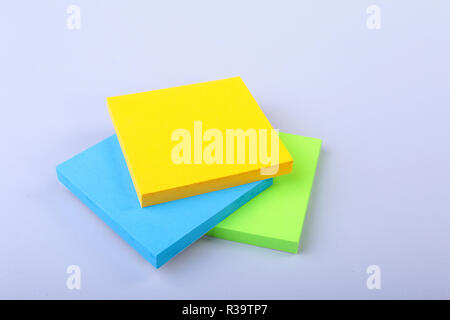 White notepad with colorful sticky reminder notes Stock Photo