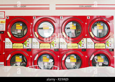 KAGAWA, JAPAN - OCTOBER 29, 2018: Row of industrial washing machines in a public laundromat Stock Photo