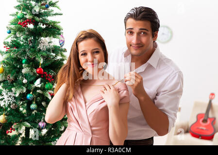 Young couple on romantic christmas date Stock Photo