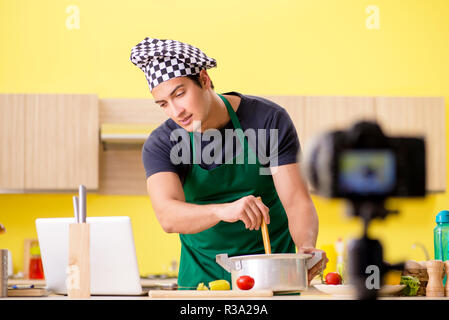 Young chef blogger explaining food preparation Stock Photo