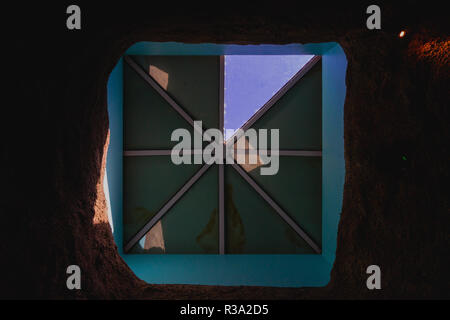 looking up through a skylight with only one window open Stock Photo