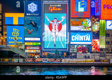 Osaka, Japan - November 21, 2018: night view of dotonbori, a principal tourist destinations in Osaka along the Dotonbori canal from Dotonboribashi Bri Stock Photo