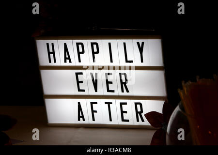 Happily Ever After lightbox pictured at a wedding in Hampshire, UK. Stock Photo