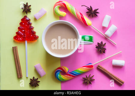 Coffee with milk and lollipop. New Year's coffee. Sweet and drink. Festive mood. Happy christmas Stock Photo