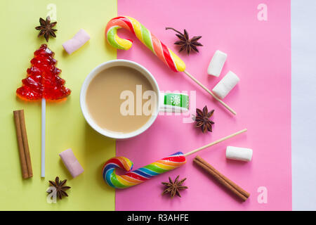 Coffee with milk and lollipop. New Year's coffee. Sweet and drink. Festive mood. Happy christmas Stock Photo