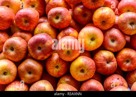 Freshly juicy picked heap of Red apples. Colorful fruit pattern. Seamless abstract design of decorative element object. Backdrop, texture decoration Stock Photo