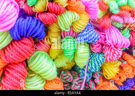 Bunch or bundle of circular nylon plastic coil cord. Seamless colorful abstract pattern design of decorative element object. Backdrop, background, tex Stock Photo