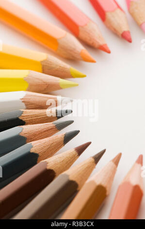 colored pencils in a semicircle brown to yellow Stock Photo