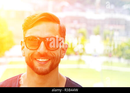 young,modern man in the sun Stock Photo