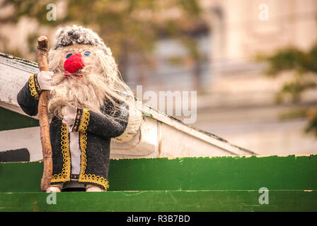 The doll representing an old man with beard and staff Stock Photo