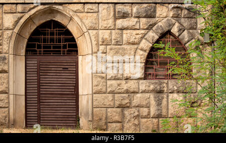 Old gothic wrought iron gate and window Stock Photo