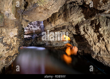 River Allt Smoo enters through a hole in the ceiling into the limestone cave Smoo Cave, Durness, Northern Highlands, Sutherland Stock Photo