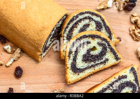 Poppy seed cake on wooden board. Stock Photo