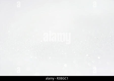 An amazing and beautiful macro of a white glow purpurin surface with glitters and depth of field Stock Photo