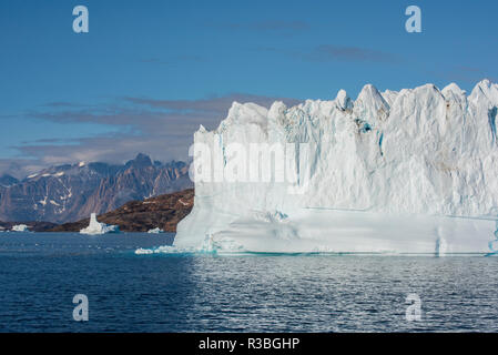 Greenland, Scoresbysund, aka Scoresby Sund, Nordvestfjord. Huge icebergs floating in calm fjord. Stock Photo