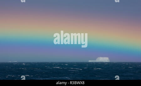 Rainbow over iceberg, South Georgia in the South Atlantic Ocean Stock Photo