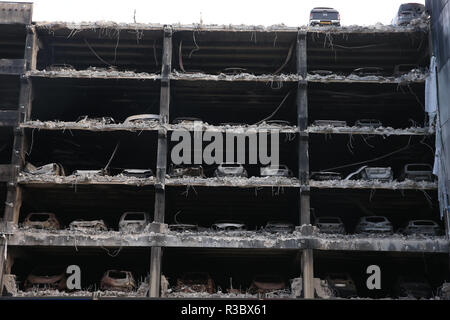 Burnt out cars and others that look undamaged but were written off by insurance companies due to fire and water damage remain in their parking spaces as work began on Wednesday to demolish the multi-storey Liverpool Waterfront Car Park near to the Echo Arena which was destroyed by fire on New Year's Eve 2017. Stock Photo