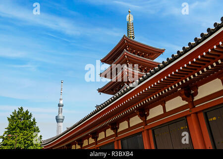 Tokyo, Japan. Five story Asakusa Pagoda and the Tokyo Sky Tree communications tower loom over the Senso-Ji temple complex Stock Photo