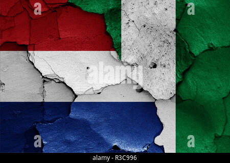 Flags of Netherlands and Nigeria painted on cracked wall Stock Photo ...