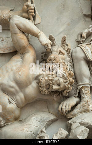 Berlin. Germany. Pergamon Museum. Pergamon Altar. Gigantomachy frieze, East panel, Aigaion mauled by a Artemis' hunting dog, detail.  The Pergamon Alt Stock Photo