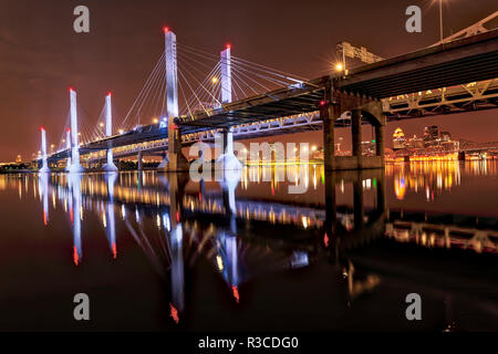 Lights on Abraham Lincoln Bridge, and downtown Louisville, Kentucky at night, viewed from Jeffersonville, Indiana Stock Photo