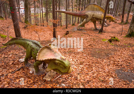 Rasnov, Romania - December 4 2017: Two different dinosaur models at Dino Park Rasnov, the only dinosaur theme park in Romania and the largest of its k Stock Photo