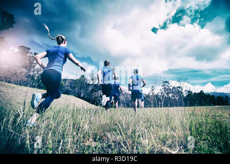 Fit people running in bootcamp Stock Photo