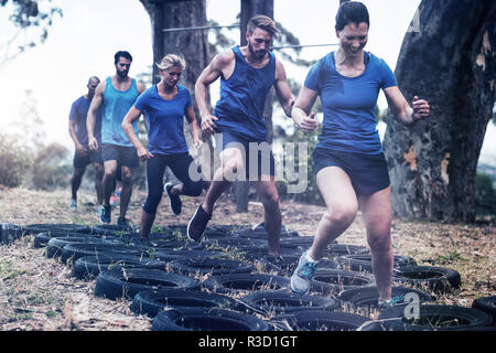 People receiving tire obstacle course training Stock Photo