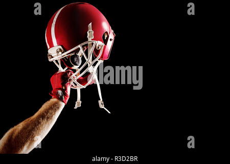 American football player cheering with arm up Stock Photo