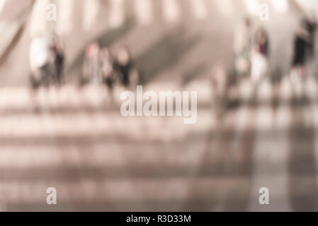 Blurred background. Blurred people walking through a city street. Toned photo. Stock Photo