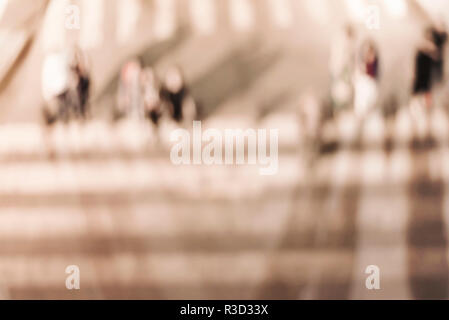 Blurred background. Blurred people walking through a city street. Toned photo. Stock Photo