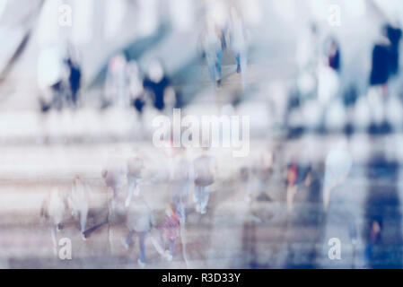 Blurred background. Blurred people walking through a city street. Toned photo. Stock Photo