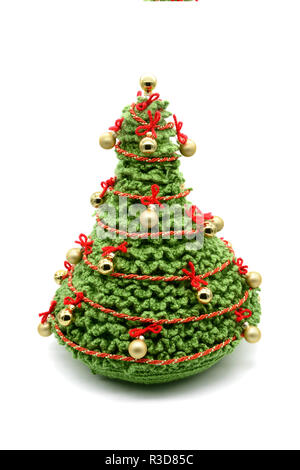 Crochet Christmas Tree isolated with balls and ornaments. made of green wool. Stock Photo
