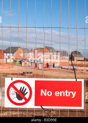 No Entry warning sign fitted on security fence at a building site in Cheshire UK Stock Photo