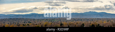 Very Wide Angle Panorama of the Colorado Mountains with Snowed Peak in the distance Stock Photo