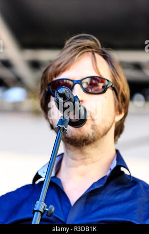 Faversham Hop Festival 2018, Head and shoulder facing shot of the male lead singer of Follia! band on stage singing into microphone. Stock Photo