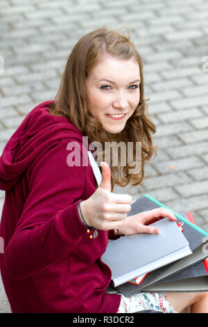 Student Teenager School Girl With Thumbs Up Stock Photo - Alamy