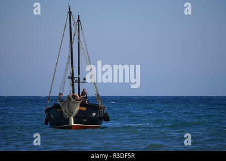 Koktebel, Crimea-June 27, 2015: Tourist ship in vintage style on the background of blue sea and horizon. Stock Photo