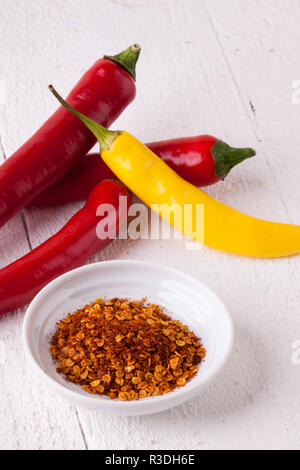 fresh pepperoni and chilli with chili powder as closeup Stock Photo