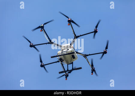 Thessaloniki, Greece - June 21, 2018: Professional agriculture drone on the green field during the test flight Stock Photo