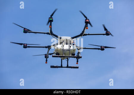 Thessaloniki, Greece - June 21, 2018: Professional agriculture drone on the green field during the test flight Stock Photo